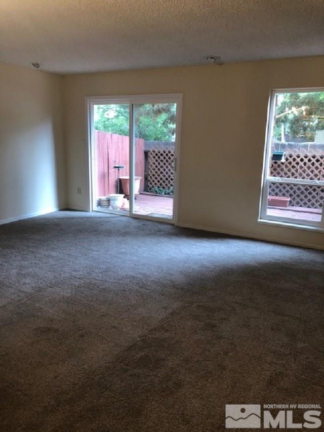 4227 Baker Lane Reno, NV 89509 - Photo 3 of 27 a view of an empty room with a window