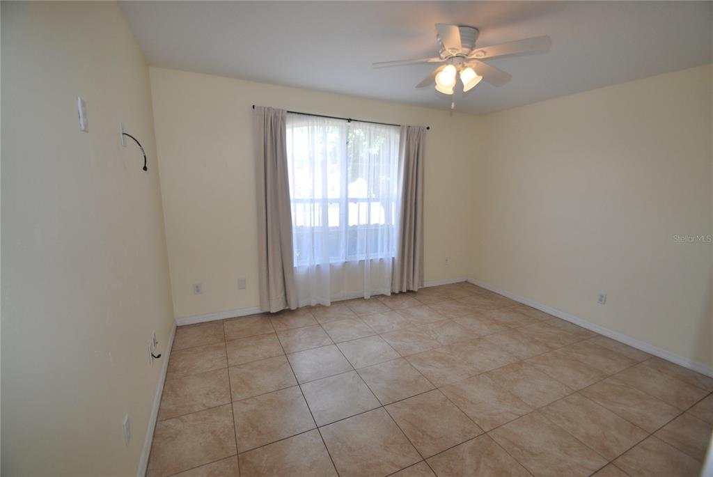 217 Robin Road Davenport, FL 33896 - Photo 16 of 27 a view of an empty room with a window