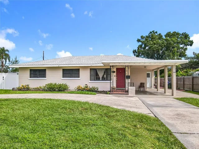a front view of a house with a garden and porch