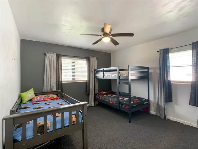 a bedroom with a bed and a tv