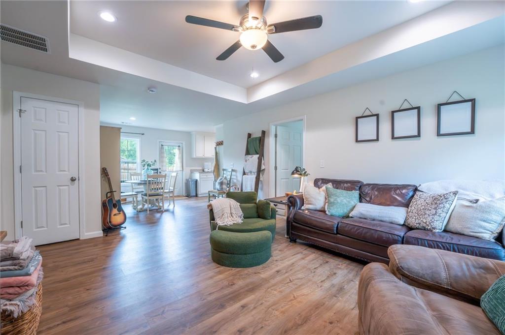118 Wash Rider Road Dahlonega, GA 30533 - Photo 4 of 37 a living room with furniture and a wooden floor