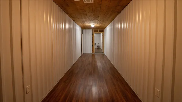 a view of gallery with wooden floor