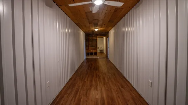 a view of gallery with wooden floor