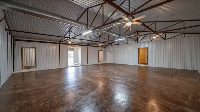 a view of a room with wooden floors