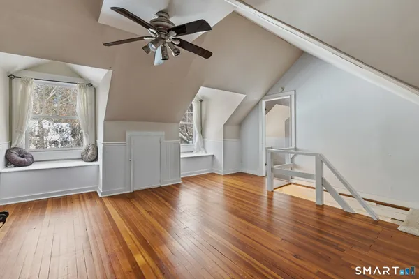 an empty room with windows and closet