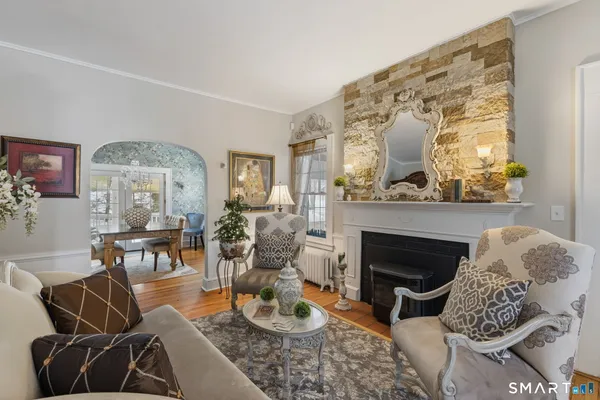 a living room with furniture and a fireplace