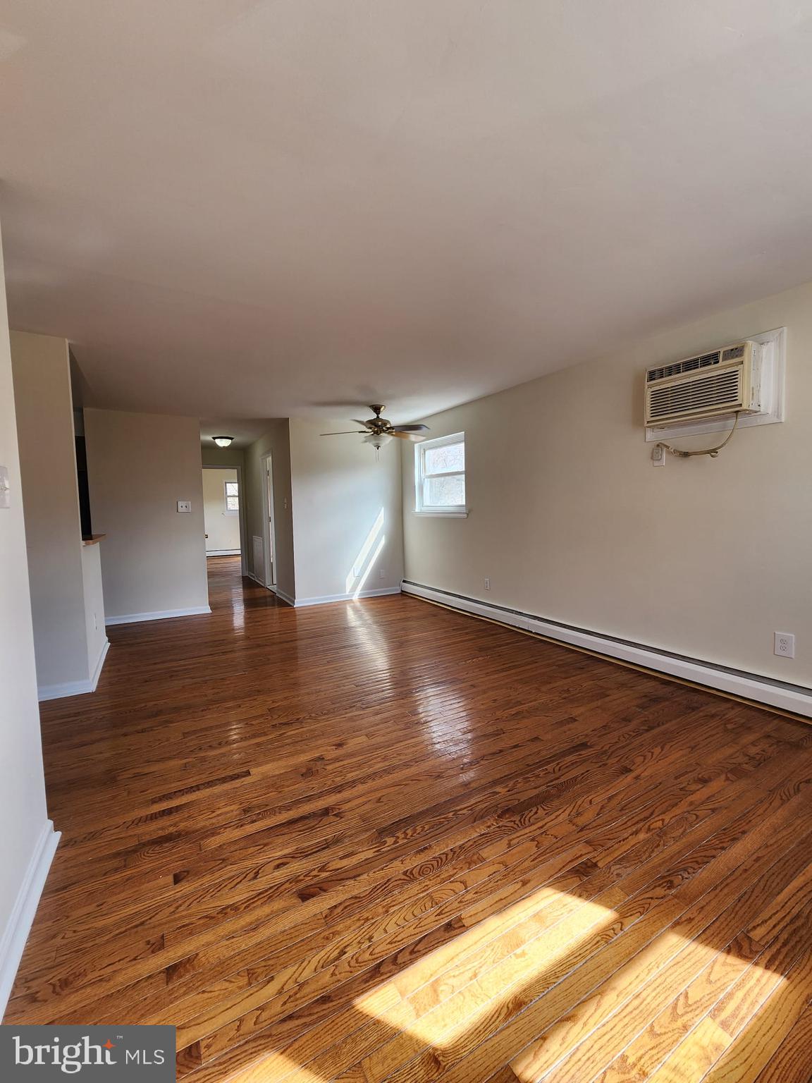 157 Meadowbrook Lane, Unit 2 Brookhaven, PA 19015 - Photo 12 of 17 a view of empty room with wooden floor
