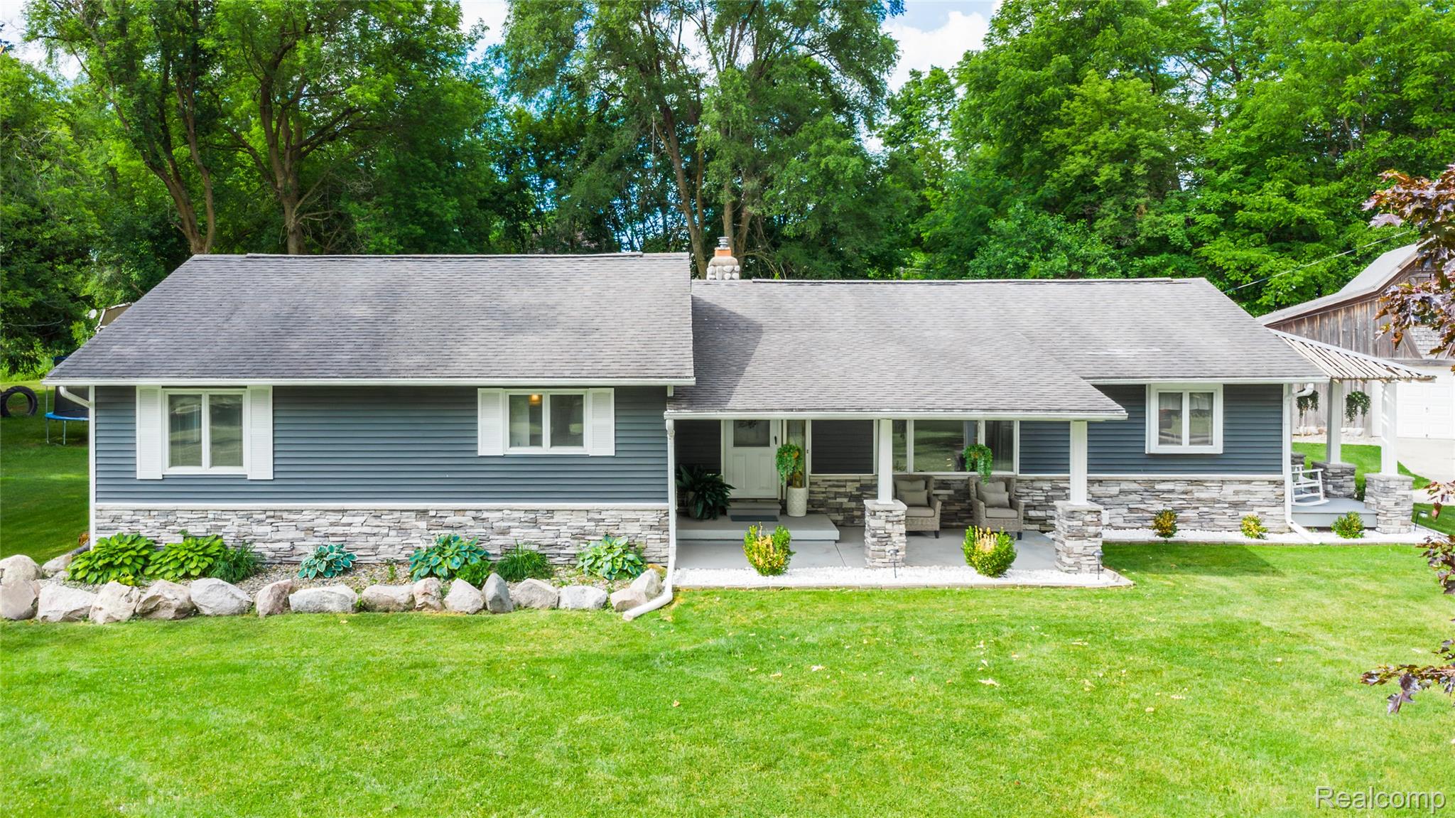 4418 North Gale Road Davison, MI 48423 - Photo 2 of 46 Ranch-style residence featuring grey siding, stone accents, and a covered front porch with stone columns