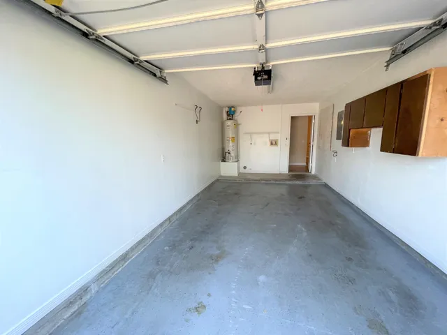 a view of a livingroom with a ceiling fan and window