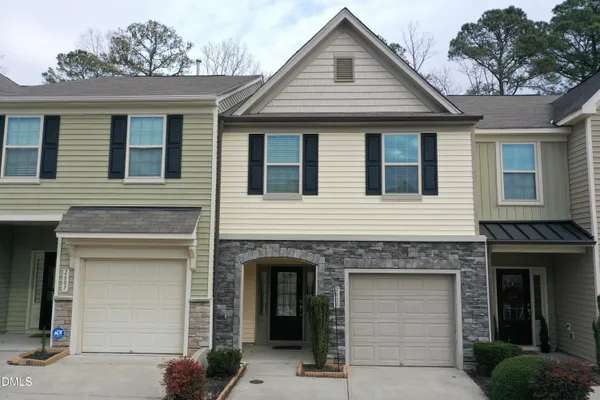 a front view of a house with a garage