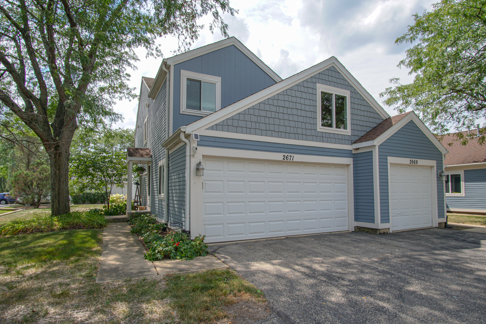 2671 Stanton Court Aurora, IL 60502 - Photo 1 of 13 a view of a house with a yard and garage