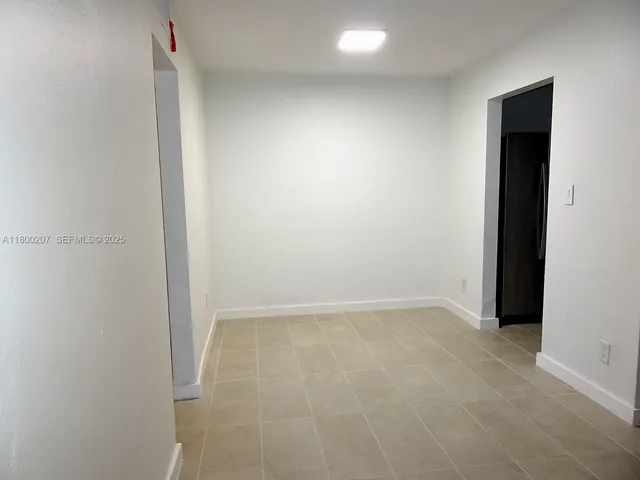 a view of a livingroom and a workspace