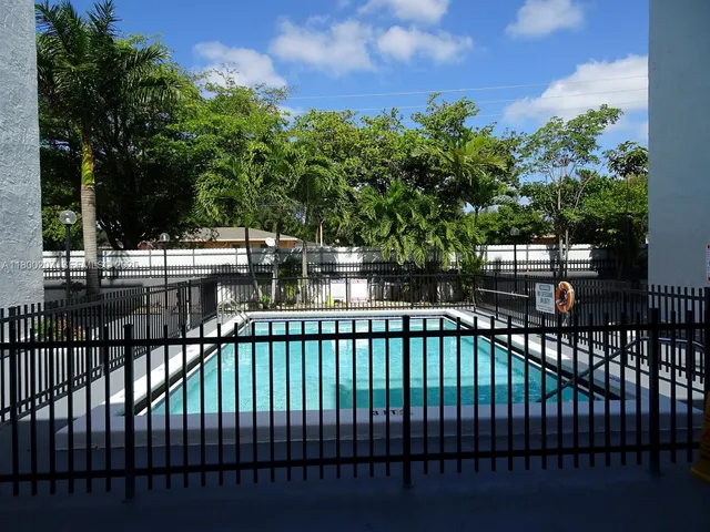 a view of a balcony with a tree