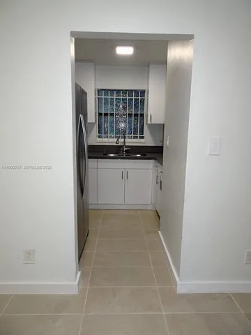 a close view of a stove a microwave and cabinets