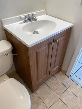 a kitchen with kitchen island granite countertop a stove and a microwave