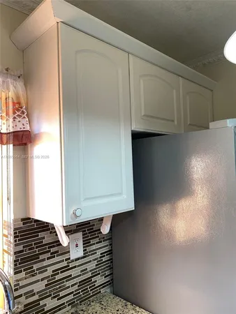 a kitchen with a sink and washing machine