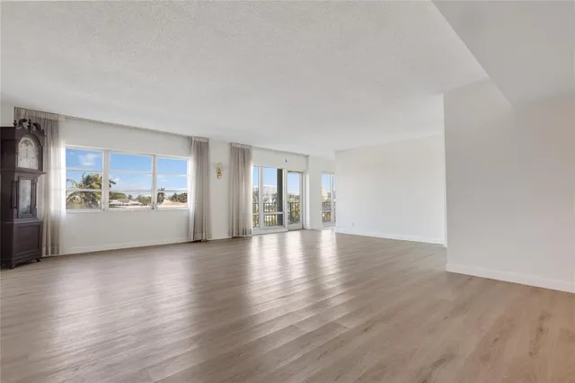 a view of a kitchen with a sink and a refrigerator