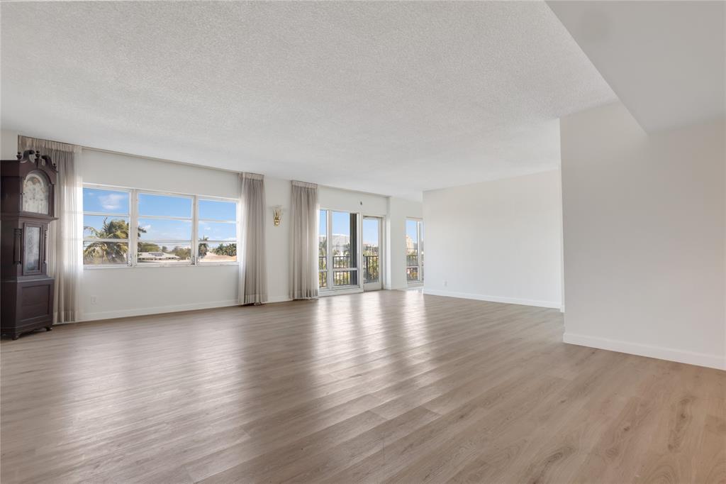 2500 East Las Olas Boulevard, Unit 406 Fort Lauderdale, FL 33301 - Photo 2 of 29 a view of a kitchen with a sink and a refrigerator