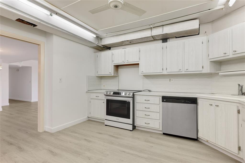 2500 East Las Olas Boulevard, Unit 406 Fort Lauderdale, FL 33301 - Photo 10 of 29 a kitchen with stainless steel appliances granite countertop a stove and a refrigerator