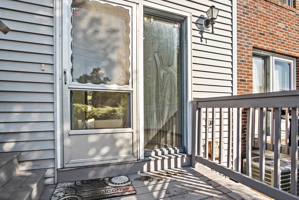 30 Angle Street, Unit 1 Lowell, MA 01851 - Photo 16 of 20 a view of a balcony with wooden floor