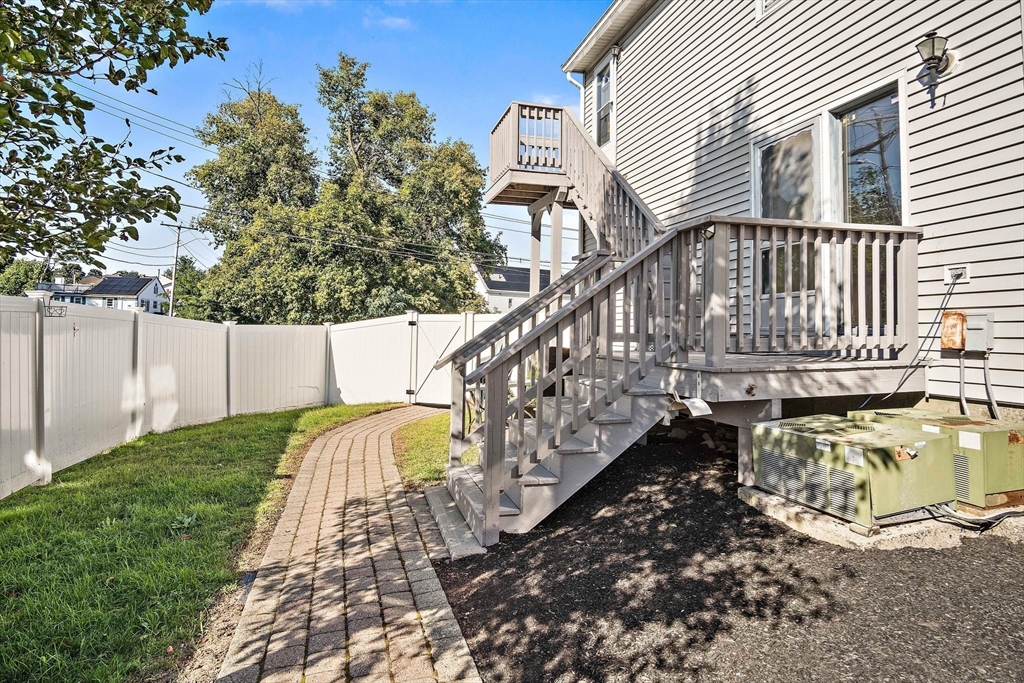 30 Angle Street, Unit 1 Lowell, MA 01851 - Photo 19 of 20 a view of a house with a yard