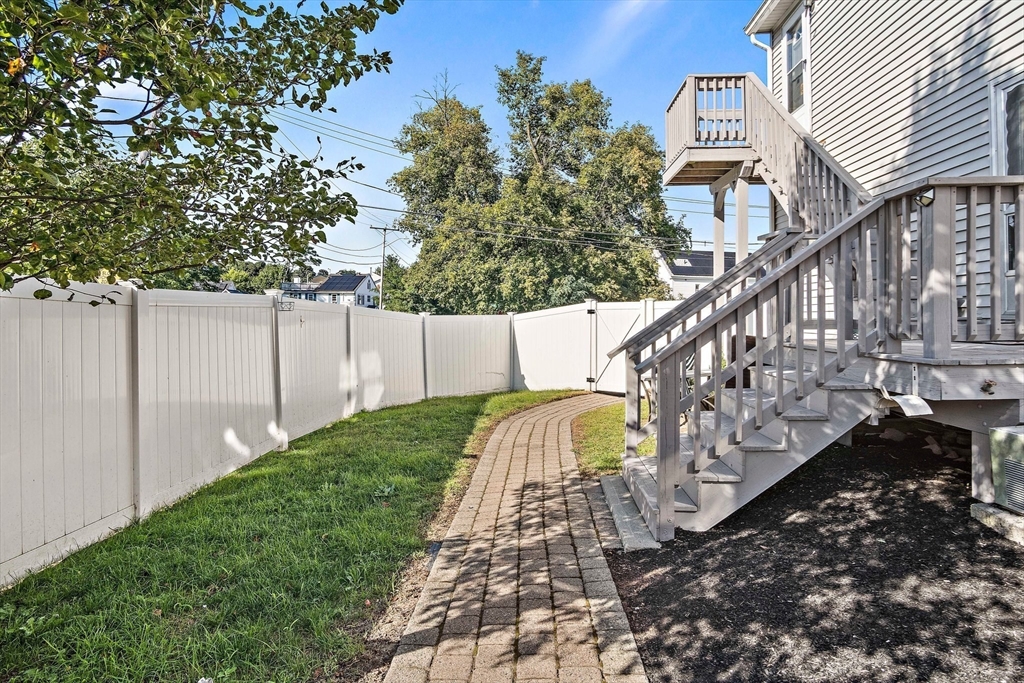 30 Angle Street, Unit 1 Lowell, MA 01851 - Photo 20 of 20 a view of a house with a yard
