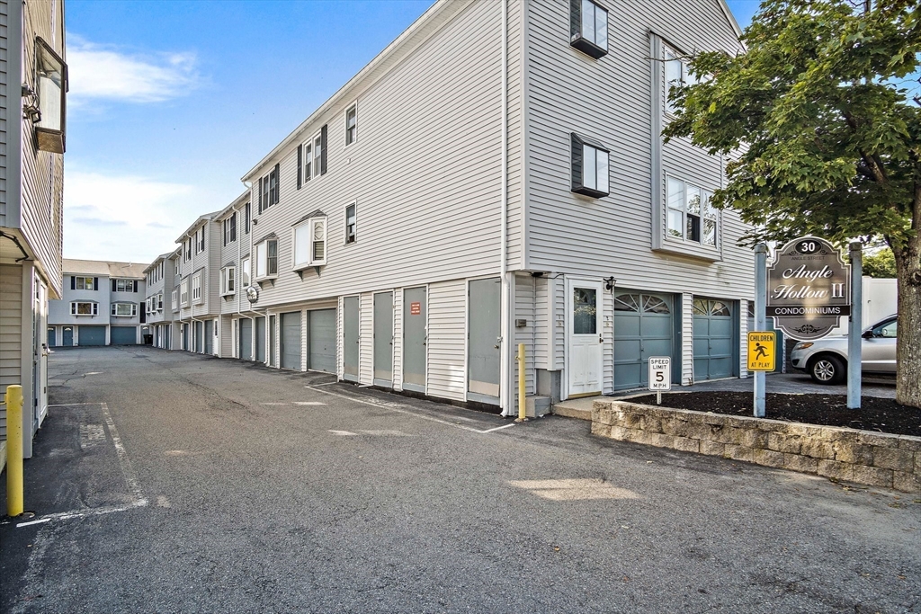 30 Angle Street, Unit 1 Lowell, MA 01851 - Photo 2 of 20 a view of a building with a street
