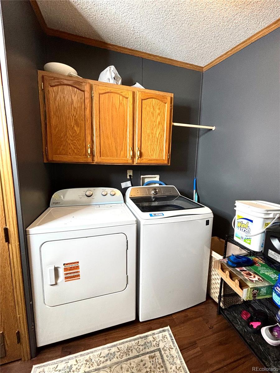 2660 Hawk Street Denver, CO 80260 - Photo 14 of 25 a utility room with dryer and washer