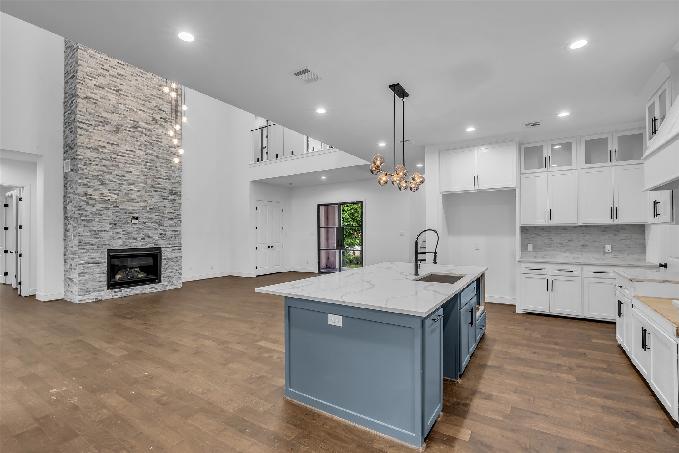 2 Deer Ridge Estates Boulevard Houston, TX 77339 - Photo 25 of 25 Another view of the kitchen and living area, highlighting the open floor plan and natural light throughout the space.