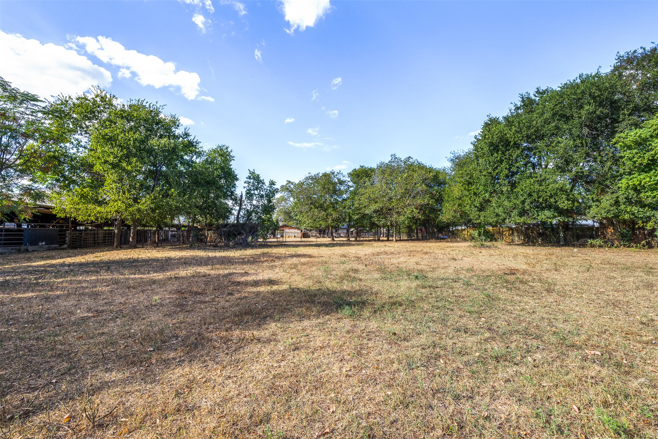 517 First Street Lexington, TX 78947 - Photo 20 of 37 a view of outdoor space with deck and yard