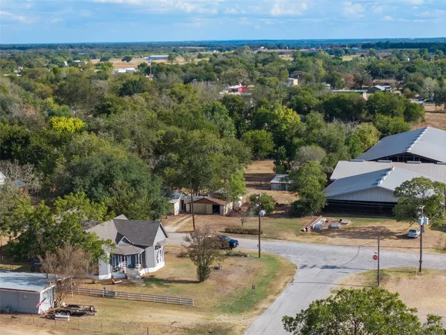 an aerial view of residential house with outdoor space