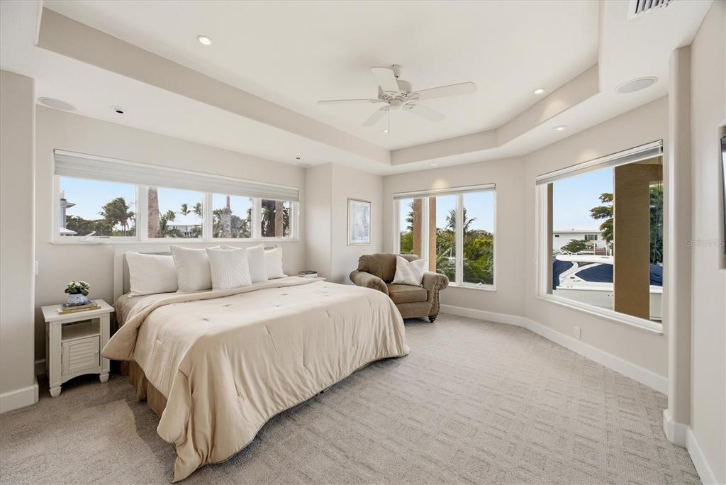 761 Norton Street Longboat Key, FL 34228 - Photo 25 of 66 a bedroom with a large bed and a window