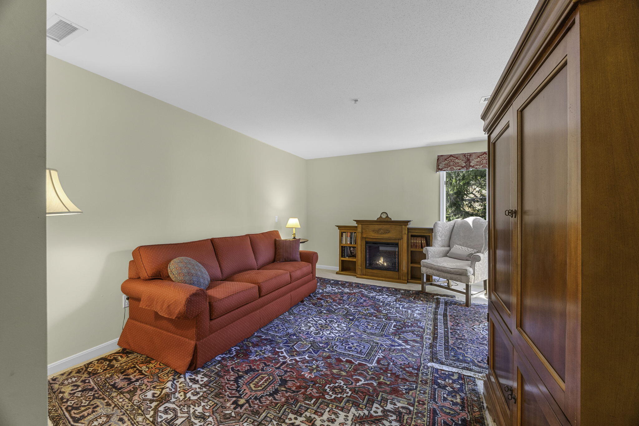 228 Kates Path Yarmouth Port, MA 02675 - Photo 14 of 30 a living room with furniture a fireplace and a flat screen tv