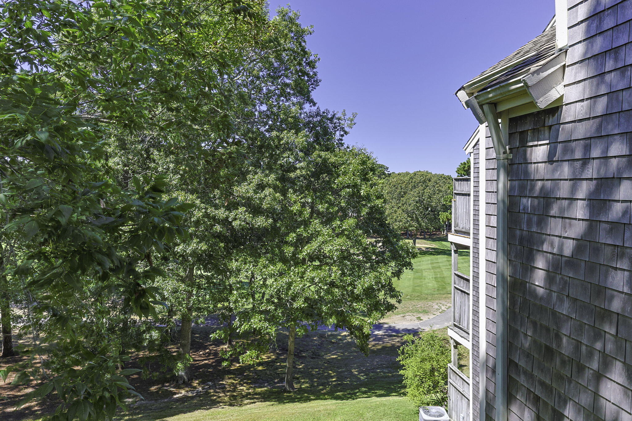 228 Kates Path Yarmouth Port, MA 02675 - Photo 20 of 30 a backyard of a house with lots of green space