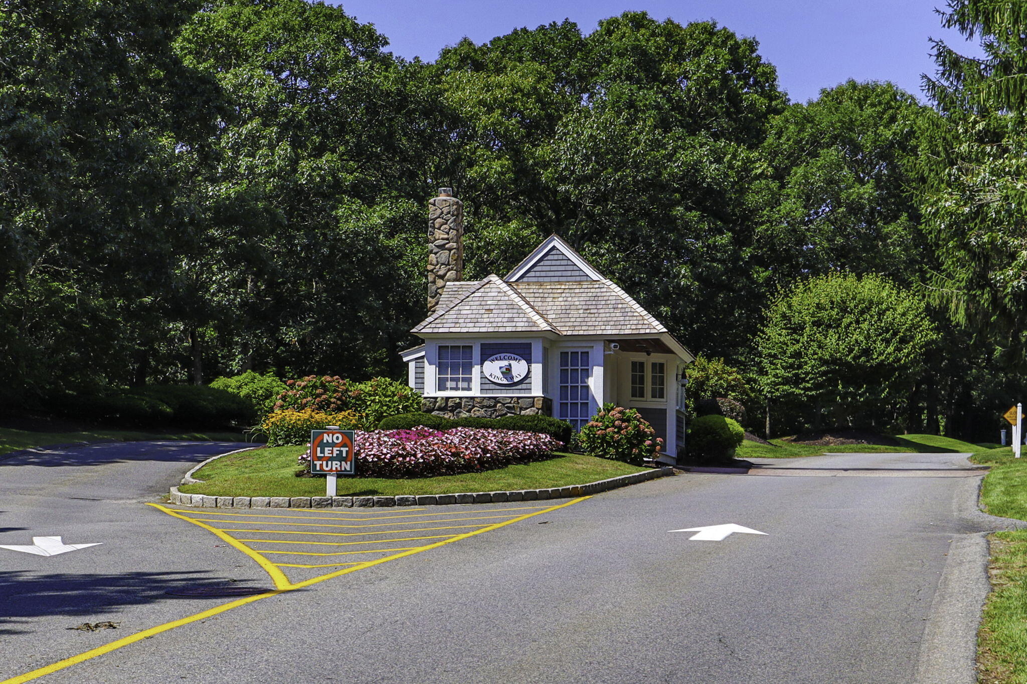 228 Kates Path Yarmouth Port, MA 02675 - Photo 23 of 30 a front view of a house with a yard and garage