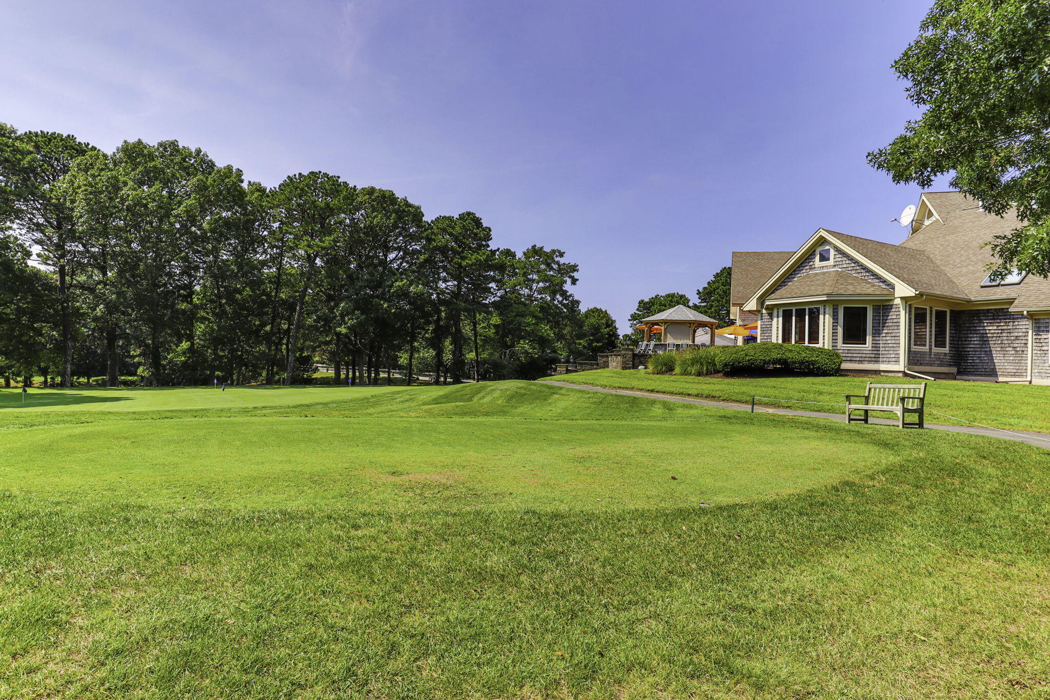 228 Kates Path Yarmouth Port, MA 02675 - Photo 29 of 30 a front view of a house with a yard