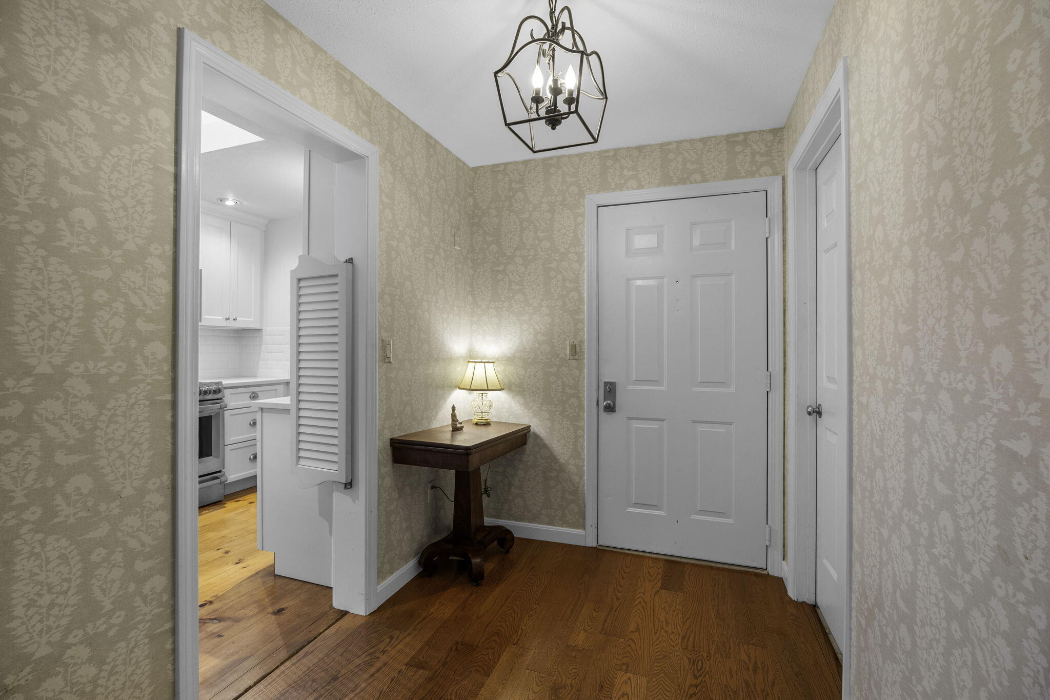 228 Kates Path Yarmouth Port, MA 02675 - Photo 3 of 30 a view of room with chandelier fan and wooden floor