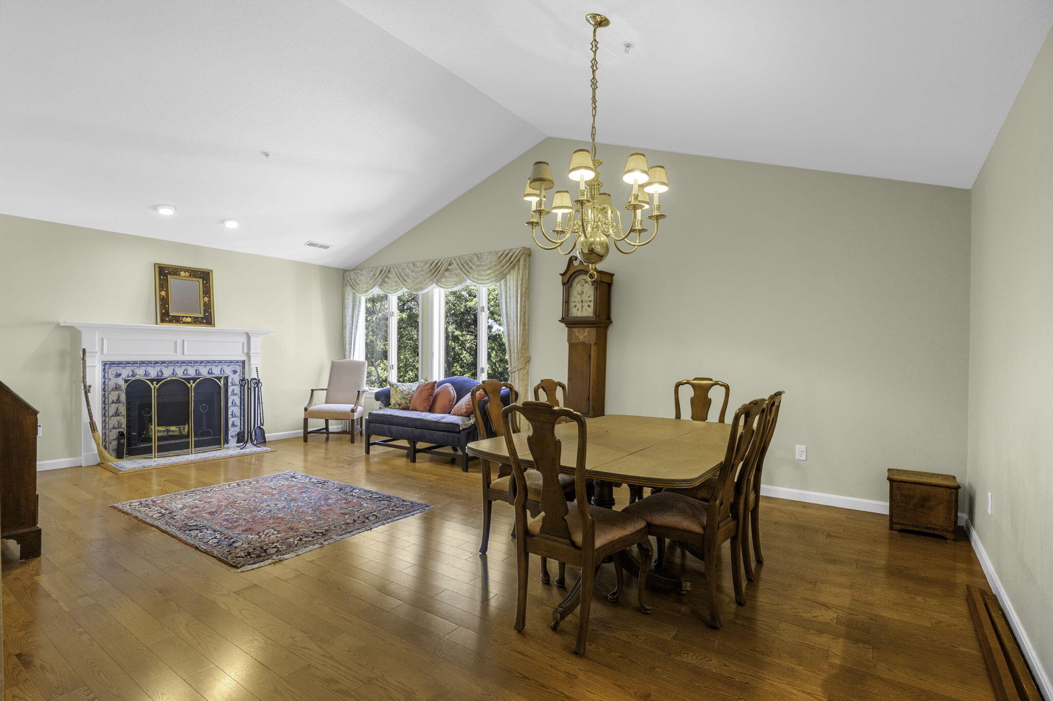 228 Kates Path Yarmouth Port, MA 02675 - Photo 4 of 30 a view of a dining room with furniture a chandelier and wooden floor