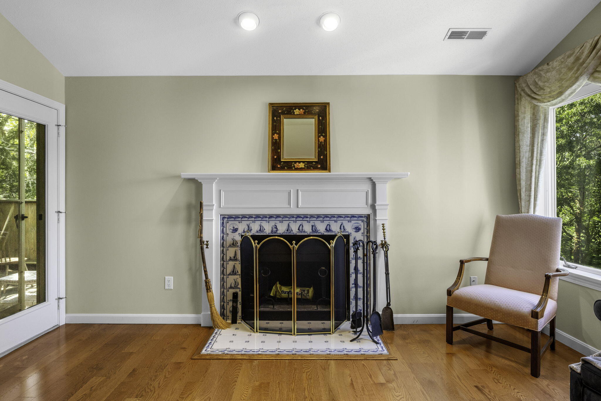 228 Kates Path Yarmouth Port, MA 02675 - Photo 8 of 30 a living room with a fireplace and a window