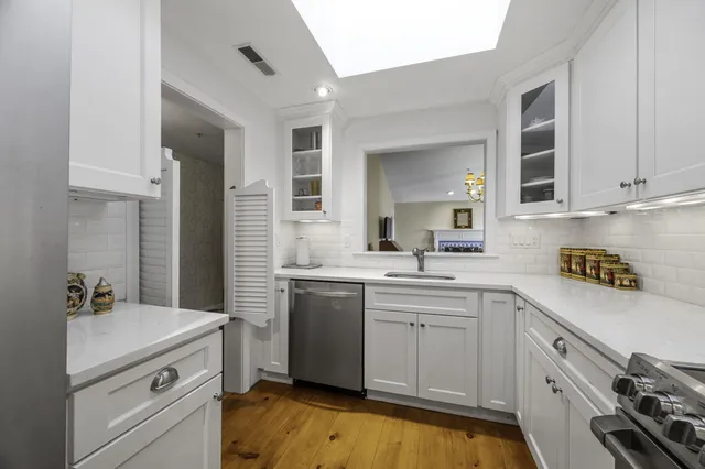 a kitchen with a sink and cabinets