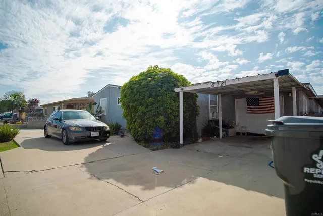 a car parked in front of a house
