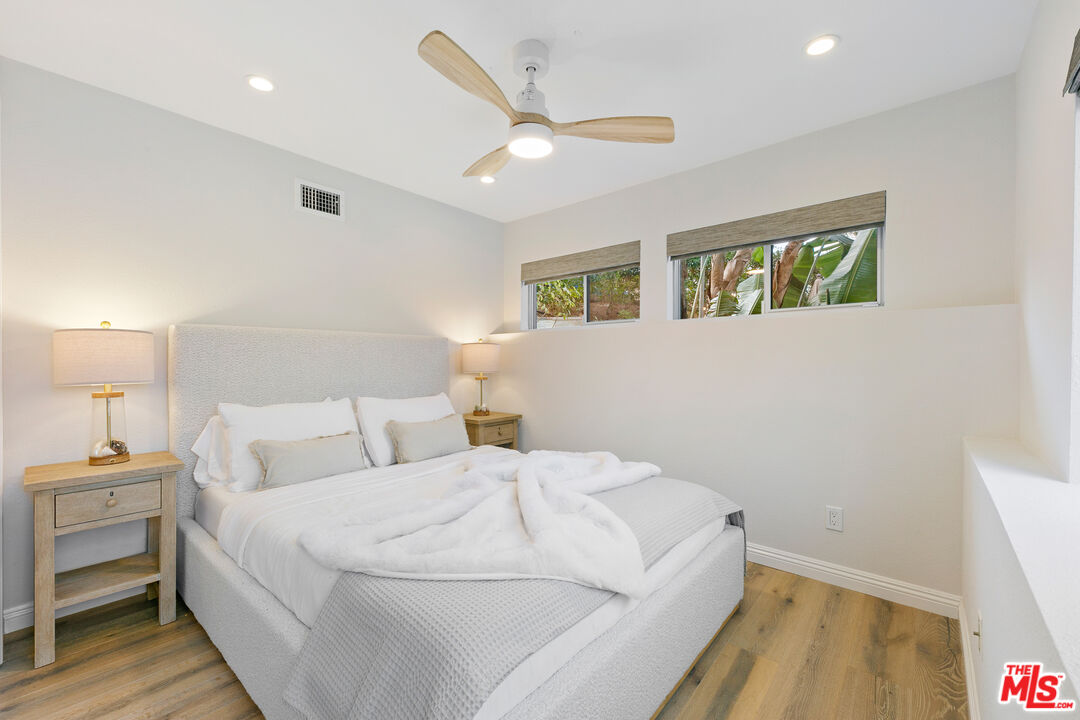 1876 Lookout Road Malibu, CA 90265 - Photo 40 of 44 a bed room with a bed and a ceiling fan