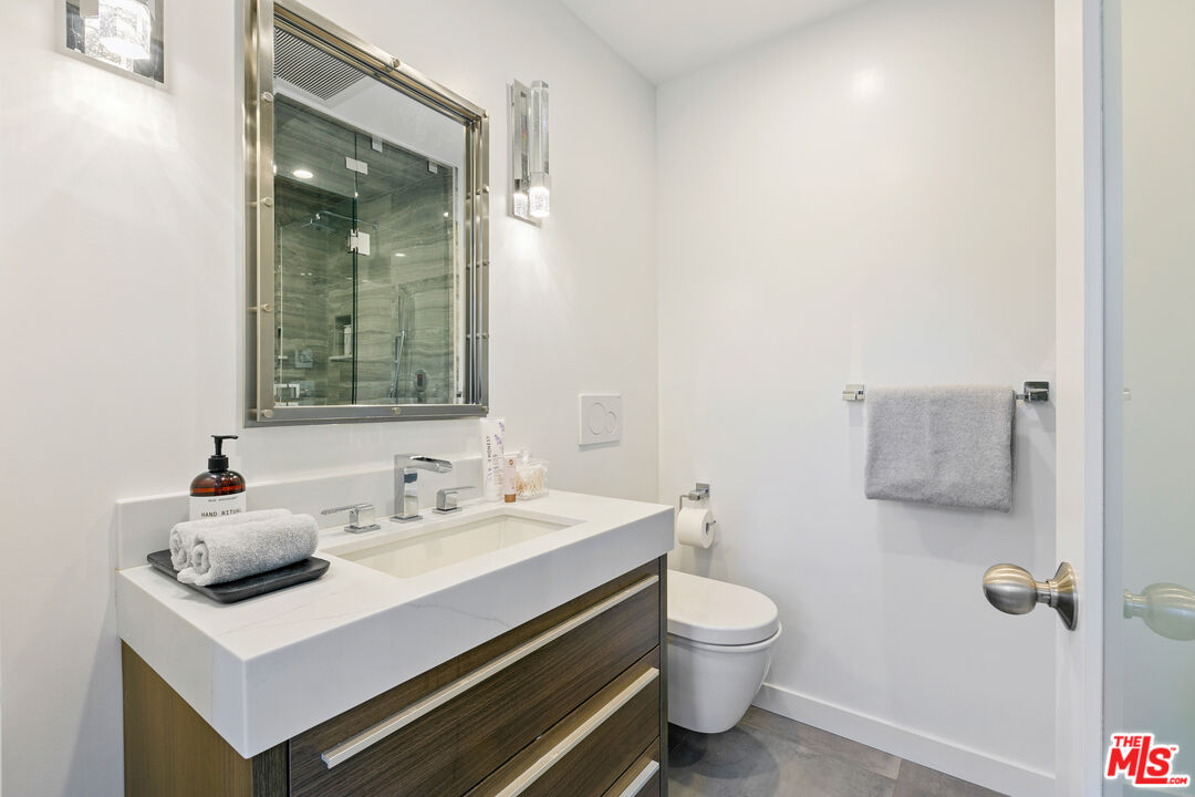 1876 Lookout Road Malibu, CA 90265 - Photo 41 of 44 a bathroom with a sink toilet and mirror