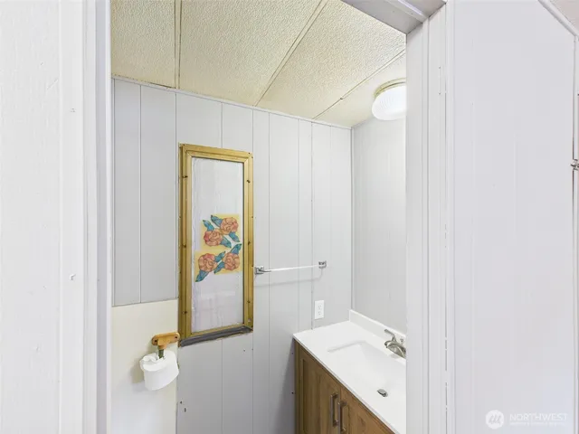 a bathroom with a sink and mirror