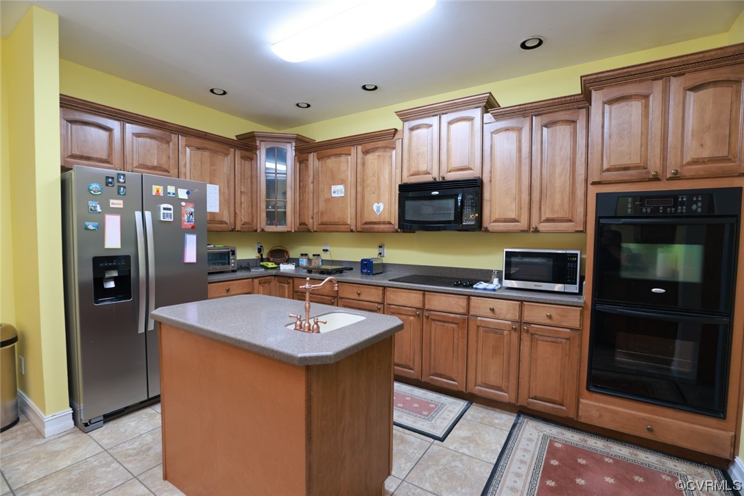 85 Rubermont Road Victoria, VA 23974 - Photo 12 of 49 a kitchen with stainless steel appliances granite countertop a refrigerator a sink and a stove
