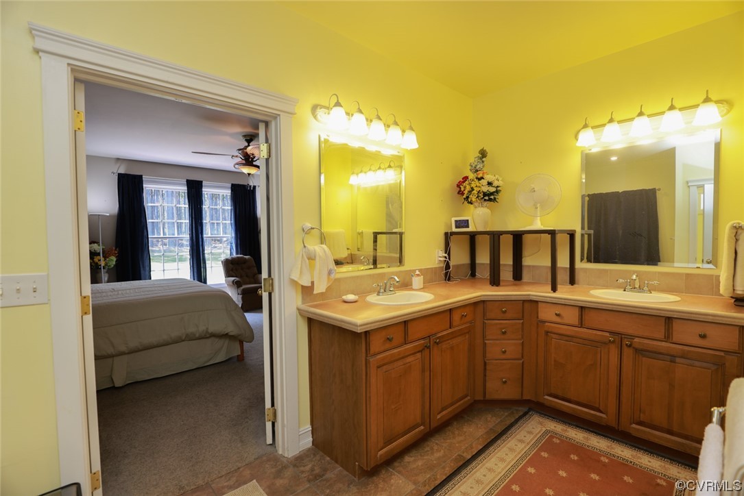 85 Rubermont Road Victoria, VA 23974 - Photo 19 of 49 a en suite bathroom with a sink and a mirror