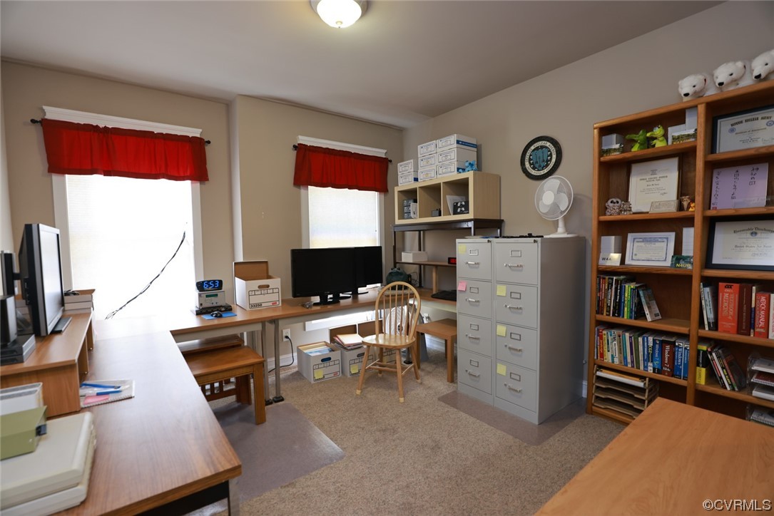 85 Rubermont Road Victoria, VA 23974 - Photo 23 of 49 a view of a workspace with a bookshelf and a window