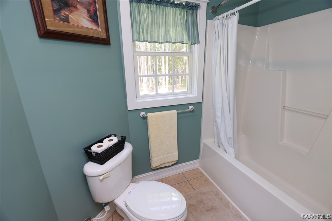 85 Rubermont Road Victoria, VA 23974 - Photo 25 of 49 a bathroom with a toilet and a shower curtain