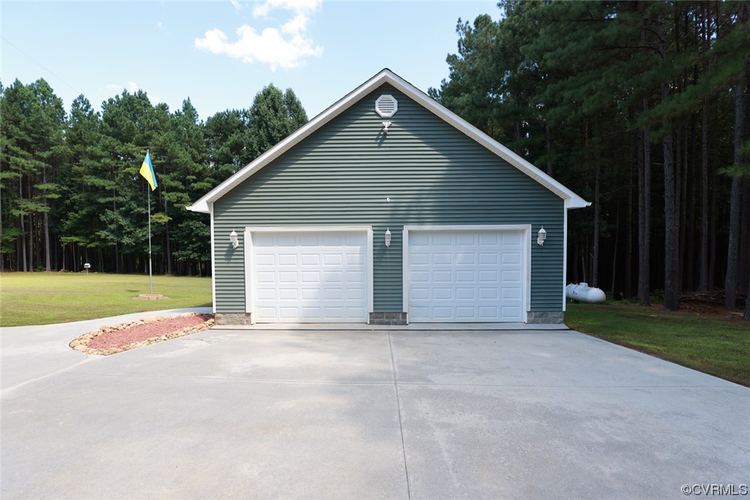 85 Rubermont Road Victoria, VA 23974 - Photo 42 of 49 a view of house with yard and garage