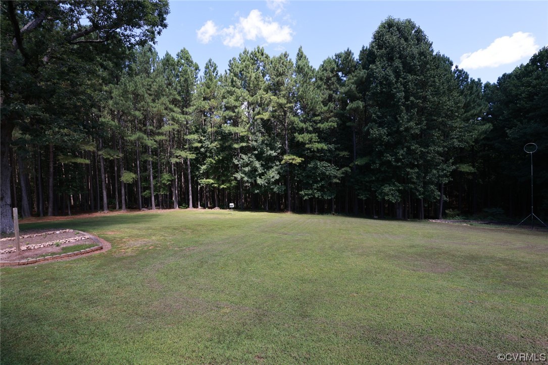 85 Rubermont Road Victoria, VA 23974 - Photo 47 of 49 a backyard of a house with yard and trampoline